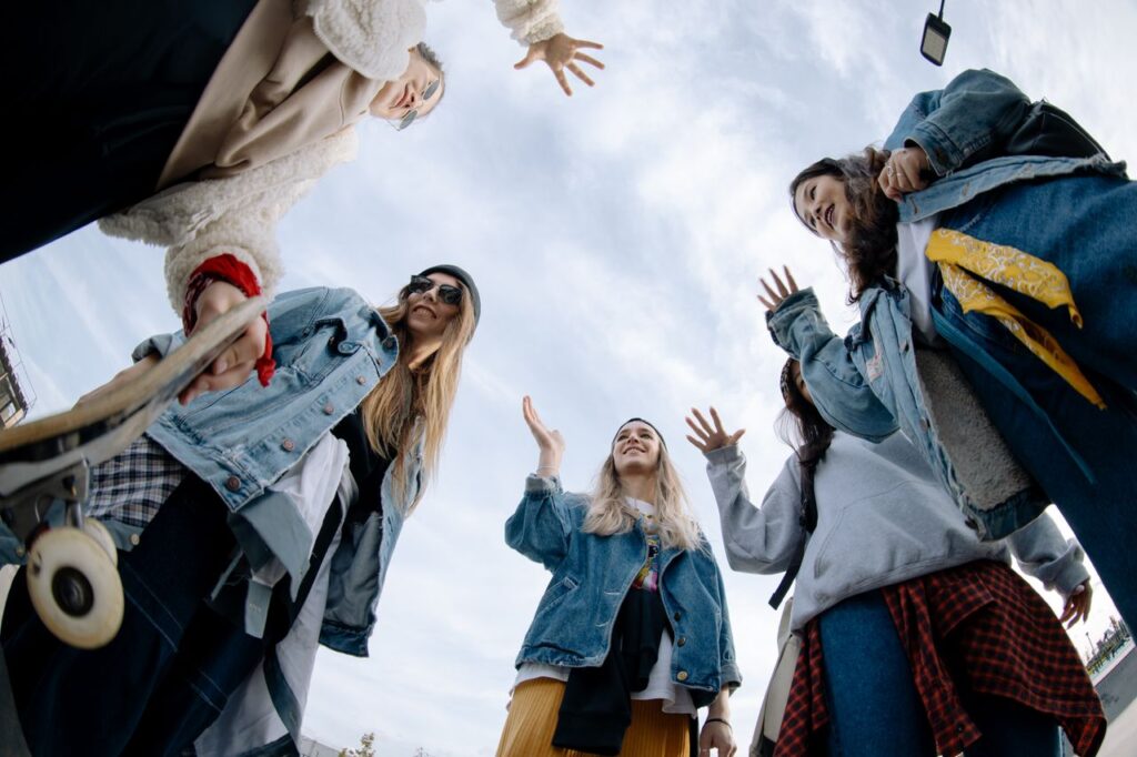 pexels photo 10117931 Low angle view of teenagers in casual outfits enjoying time at a skate park