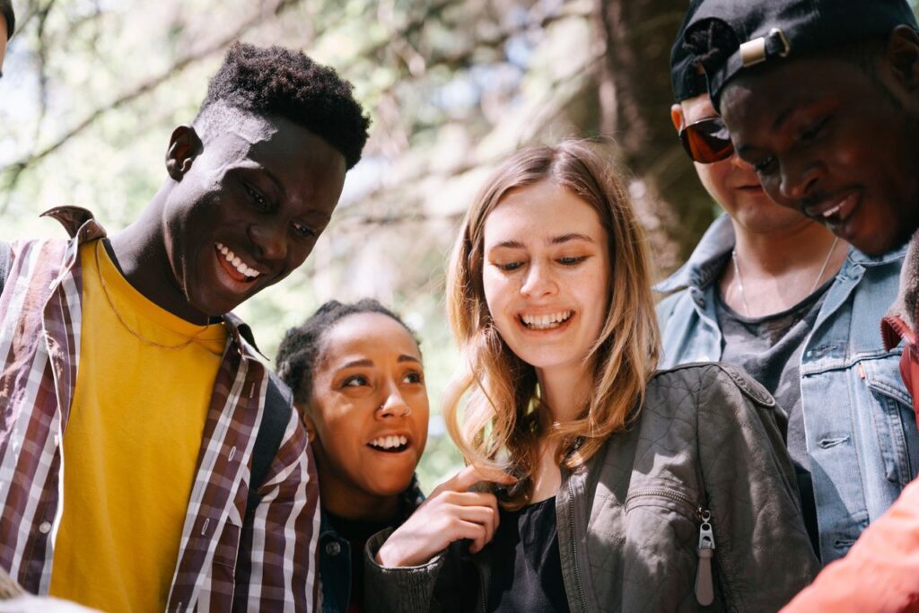 pexels photo 9630189 9630189 A group of diverse young adults enjoying a moment together outdoors, smiling and happy.